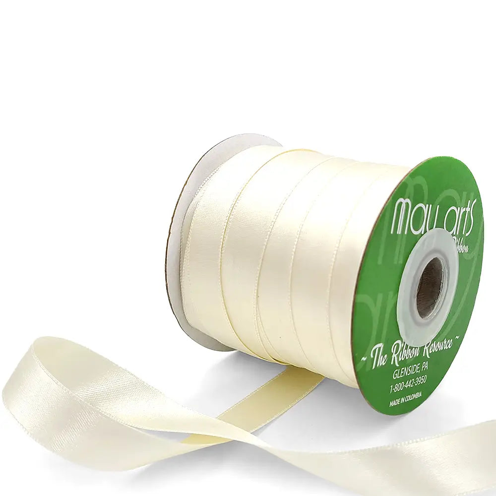 Ivory ribbon spool with visible brand name on a white background