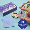 Cross stitch kit with a completed design, materials, and an advent calendar on a light blue background.