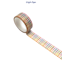 Roll of washi tape with a checkered pattern on a white background