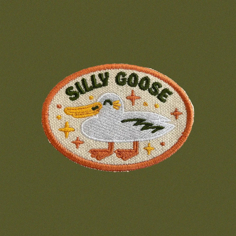 Embroidered patch with a goose design and 'Silly Goose' text on a green background