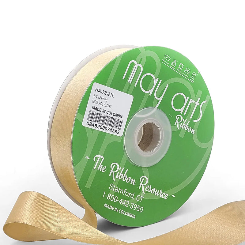Gold ribbon spool with visible brand name on a white background