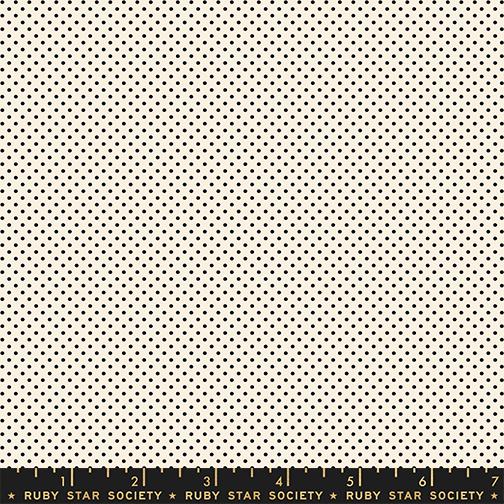 Patterned fabric with small black dots on a white background, featuring Ruby Star Society label.