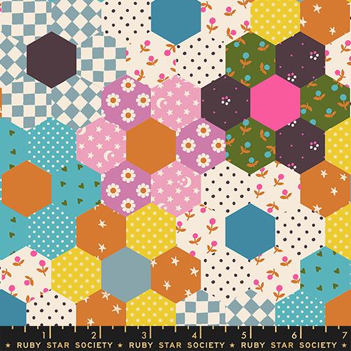 Colorful hexagonal pattern fabric with a ruler at the bottom