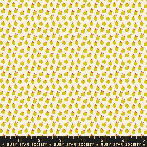 Pattern of small green apples with red stems on a beige background, featuring Ruby Star Society label.