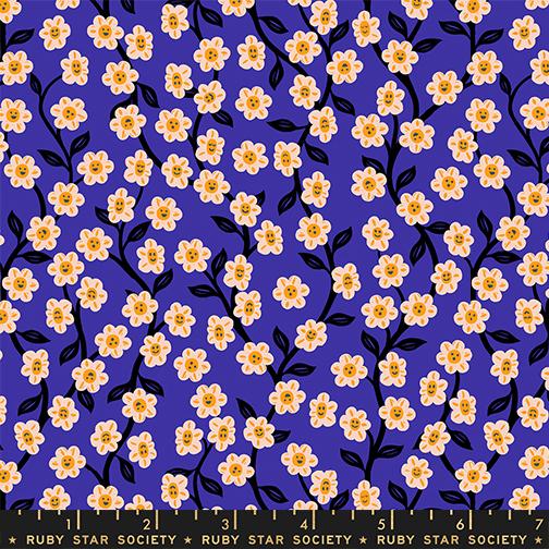 Floral pattern with yellow flowers with faces on a purple background, featuring a ruler at the bottom.