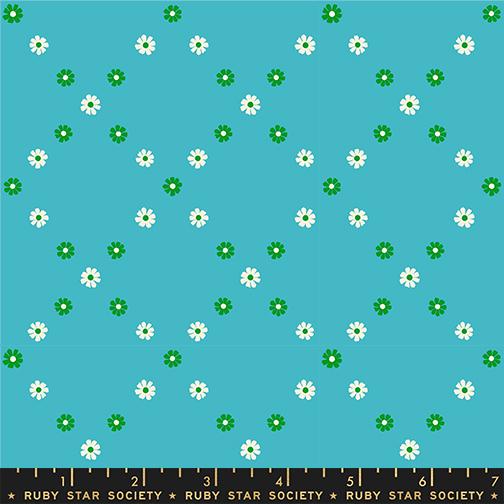Floral pattern with white flowers and green leaves on a blue background, featuring Ruby Star Society label.