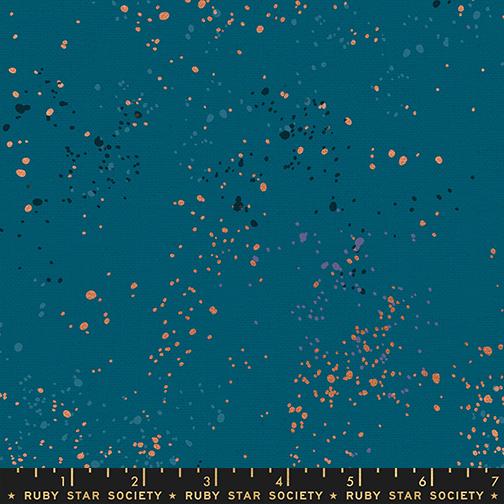 Fabric pattern with small gold and silver dots on a blue background, featuring Ruby Star Society label.
