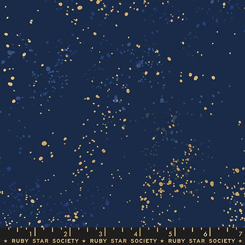 Fabric pattern with gold dots on a navy background, featuring Ruby Star Society label.