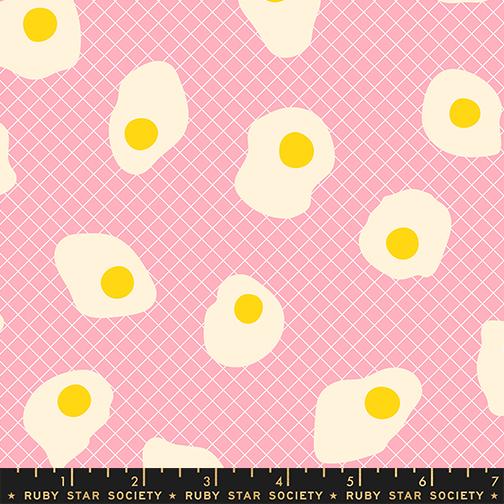 Pattern of white eggs with yellow yolks on a pink background with grid lines, Ruby Star Society label at the bottom.