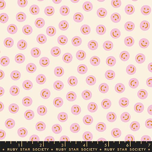 Pink smiley face pattern on a white background with Ruby Star Society label