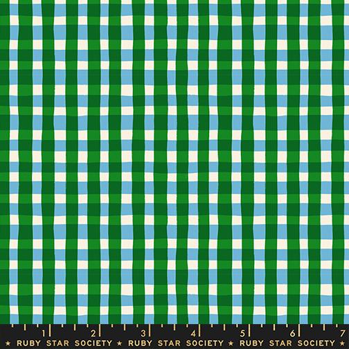 Green and blue checkered fabric with a ruler at the bottom