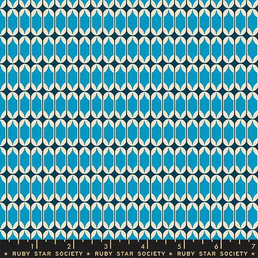 Patterned fabric with blue and white shapes on a dark background, featuring Ruby Star Society label.