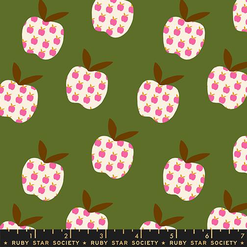 Pattern of pink and white apples with brown stems on a green background, featuring Ruby Star Society label.