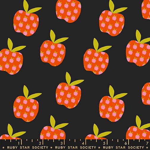 Pattern of red apples with green stems on a black background, featuring a ruler at the bottom.