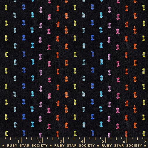 Fabric with colorful pattern on a black background, labeled Ruby Star Society.
