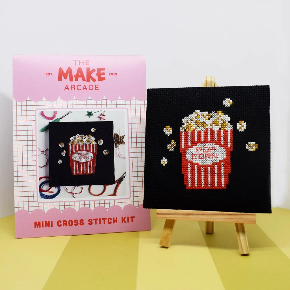 Make Arcade mini cross stitch kit with a completed popcorn design on a black background.