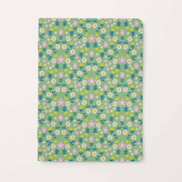 Floral patterned notebook on a light green background
