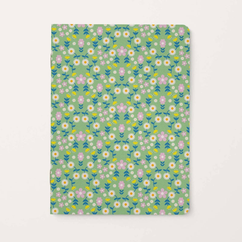 Floral patterned notebook on a light green background