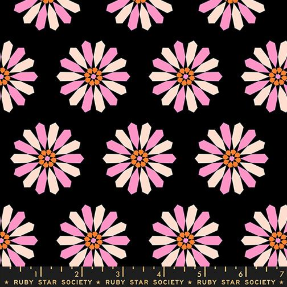 fabric swatch of a black background with pink and orange geometric flowers 