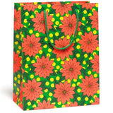 Gift bag with red poinsettia flowers
