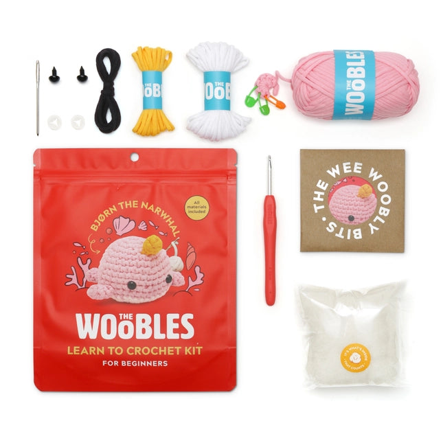 Contents of the kit including the pouch, crochet hook, stuffing, yarn, stitch markers, needle, eyes and instructions.