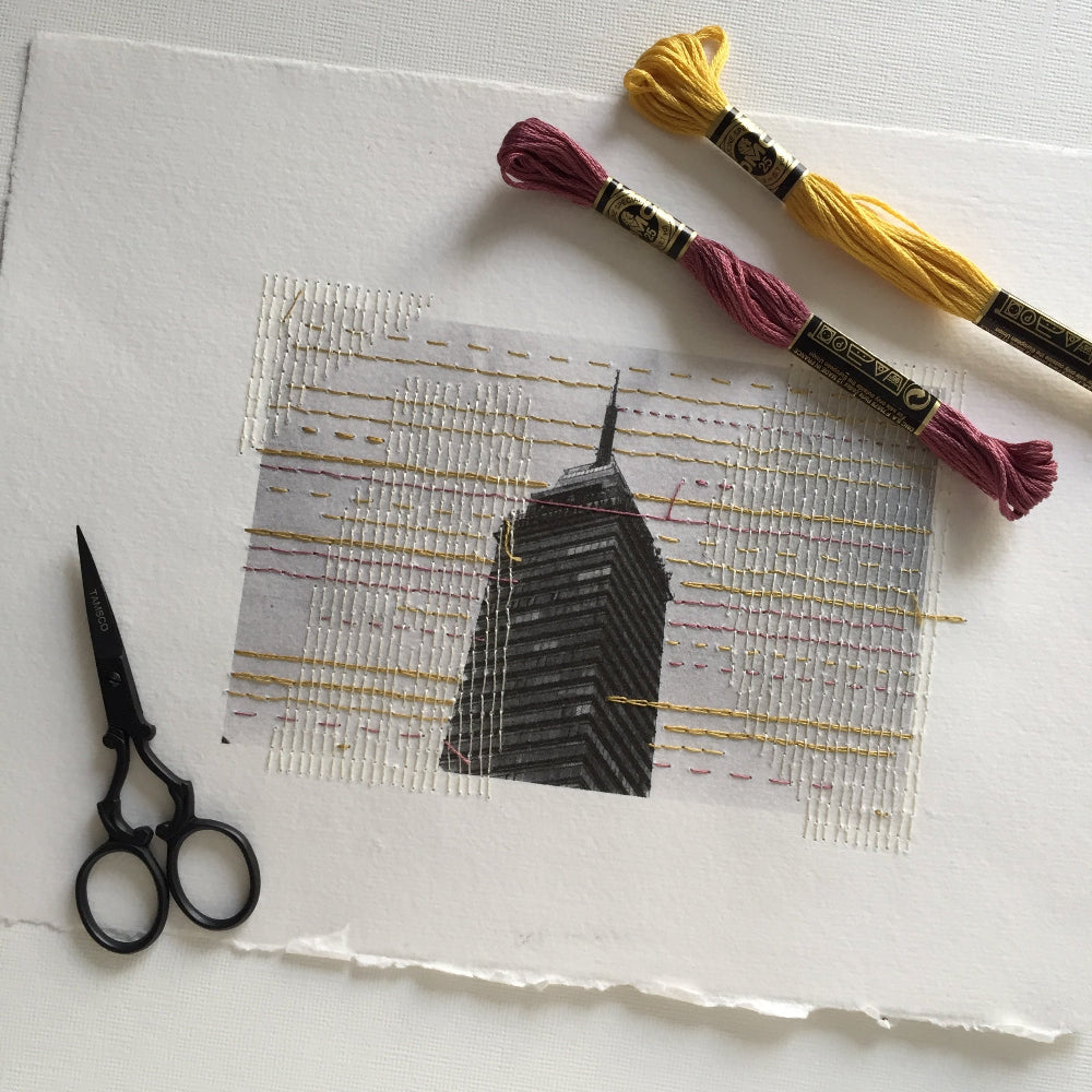 Embroidered photo of a skyscraper with materials