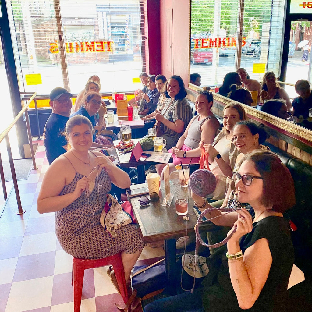 folks celebrating at the 2024 knit in public day