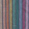 Striped fabric with multicolor pattern on a dark background and 'Fableism' branding.