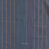 Textured dark fabric with multicolored vertical stripes and 'Fableism' branding.