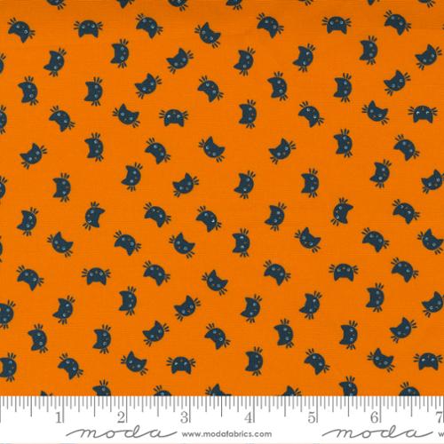 Orange fabric with black cat pattern