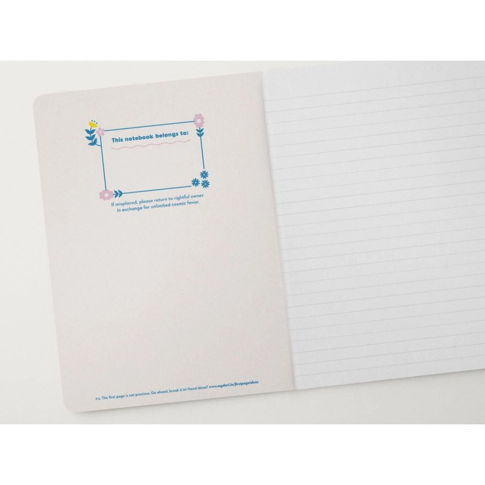 Notebook with a decorative cover and lined pages on a white background