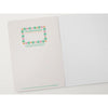 Notebook with decorative cover and lined pages on a white background