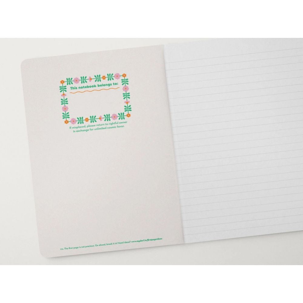 Notebook with decorative cover and lined pages on a white background