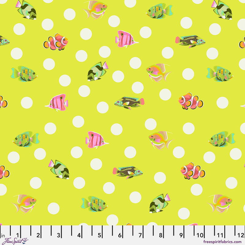 Colorful fish pattern on a bright green background with white polka dots
