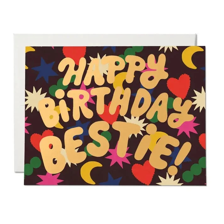 Card that reads Happy Birthday Bestie and has colorful charms in the background