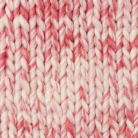 A knit swatch of Wool and the Gang's Crazy Sexy Wool in a pink and white variegated colorway. 