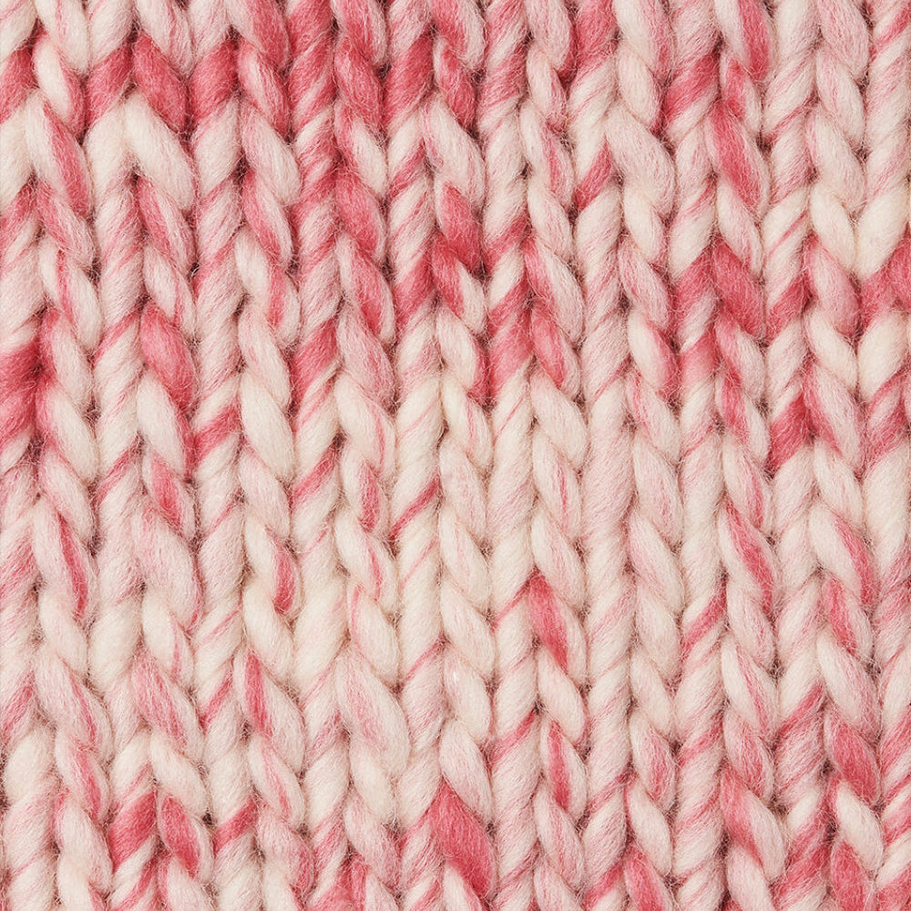 A knit swatch of Wool and the Gang's Crazy Sexy Wool in a pink and white variegated colorway. 