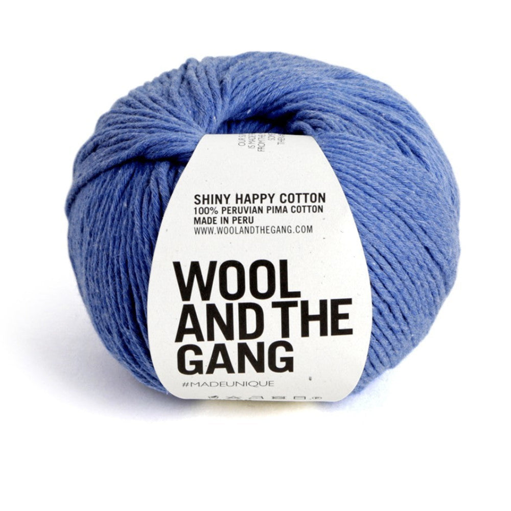 Blue yarn ball with 'Wool and the Gang' label on a white background