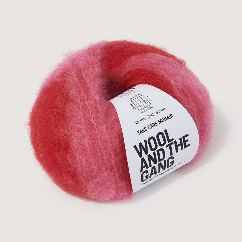 Red and pink ball of yarn with a label on a white background
