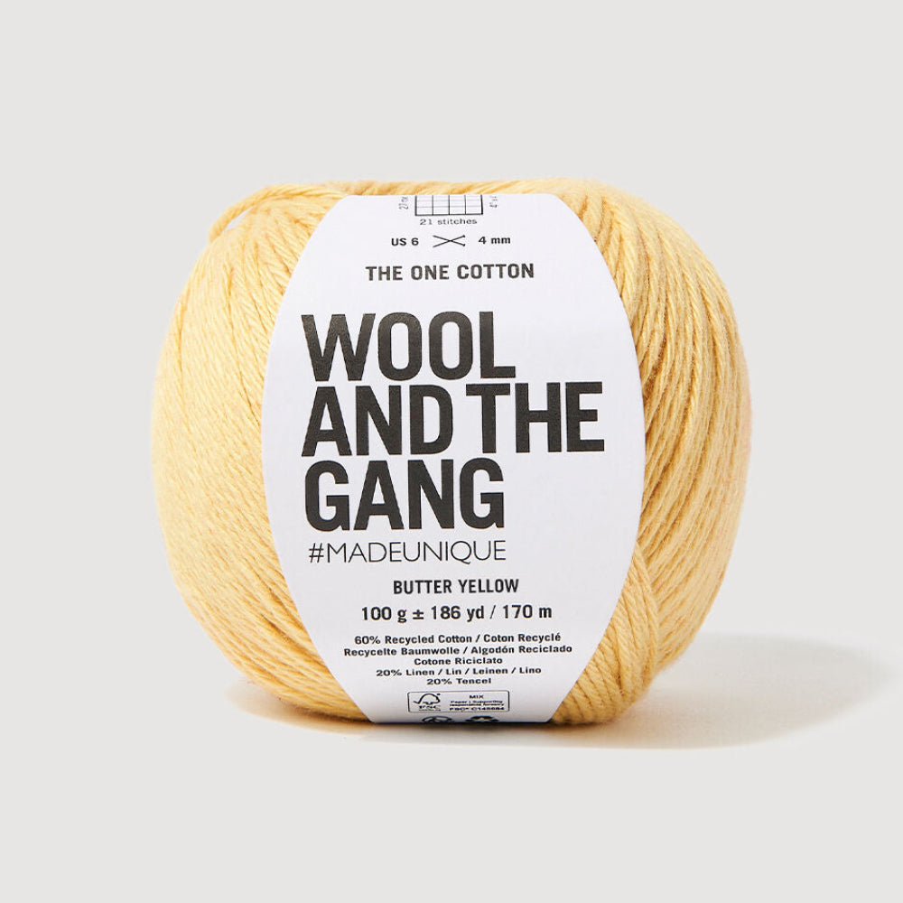 Yellow ball of yarn with 'Wool and the Gang' label on a white background
