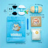 Kit content including the pouch, yarn, instructions, tapestry needle, stuffing, plastic eyes, stitch markers and crochet hook.