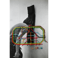 embroidered photo of a person wearing a sweater with colorful geometric design and 'U.Berlin' text.