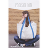 Woman holding a white tote bag with blue straps against a wooden background, featuring 'noodlehead' branding.