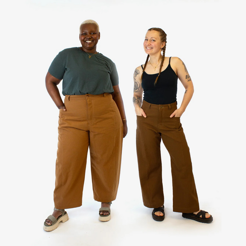 Two people wearing brown pants on a white background