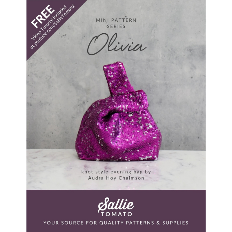 Pattern book cover for a knot style evening bag with a purple glittery bag on a gray background.