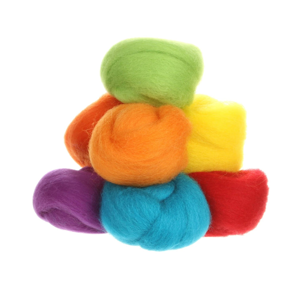 Stack of colorful roving in green, orange, yellow, red, and blue on a white background
