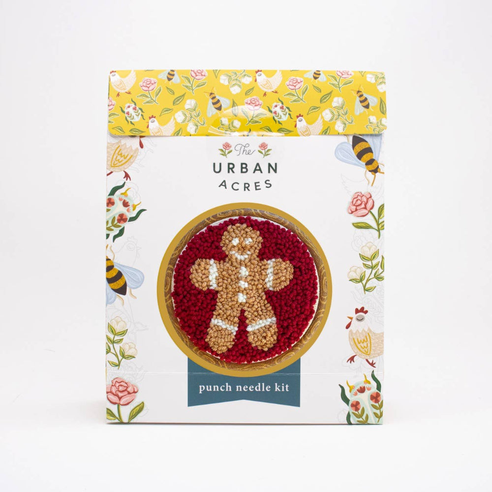Punch needle kit packaging with a gingerbread man design on a white background