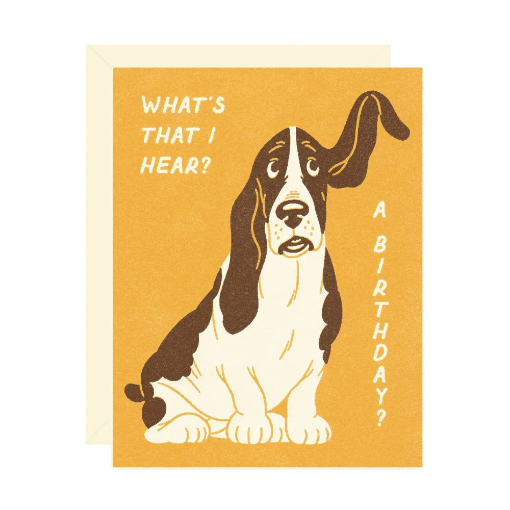 Birthday card with a dog illustration and text on a yellow background