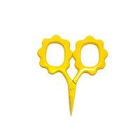 Yellow scissors with decorative handles on a white background