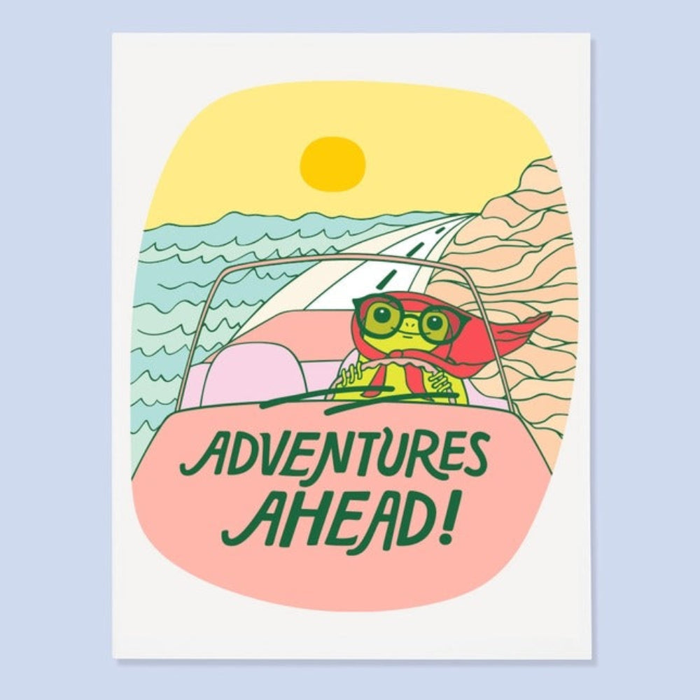 Illustration of a frog driving a car with 'Adventures Ahead!' text, set against a beach scene.